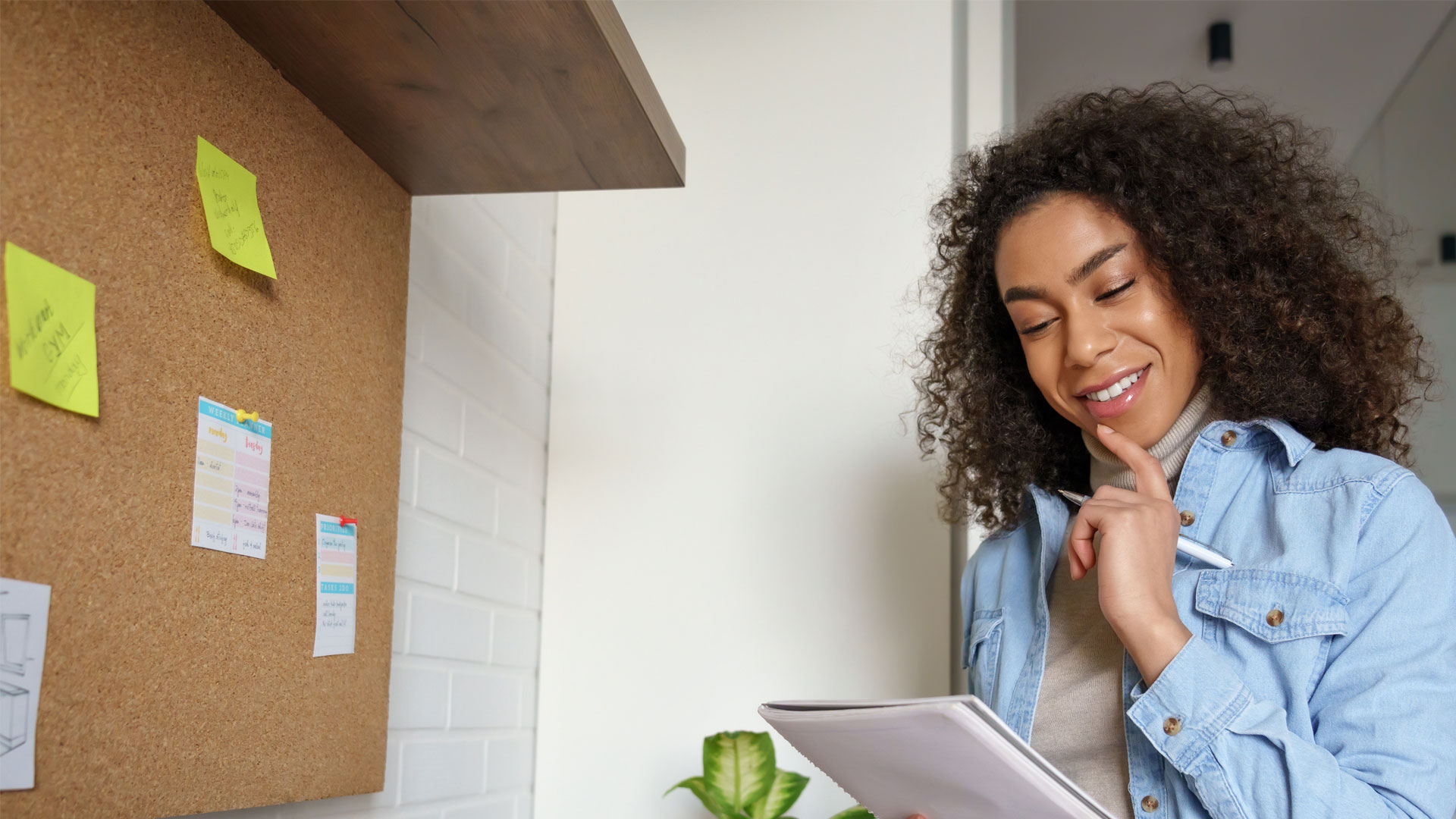 Lady holding a notebook planning