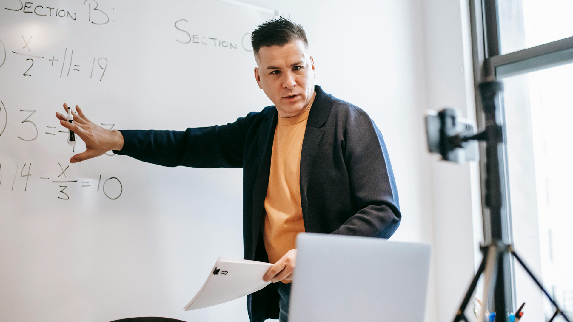 Man teaching with a whiteboard