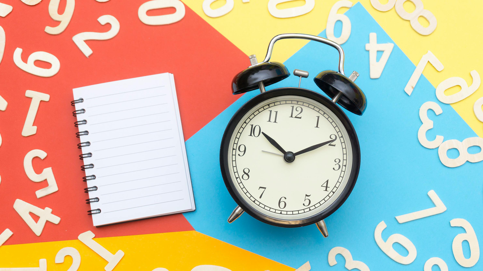 A notebook and clock surrounded by numbers