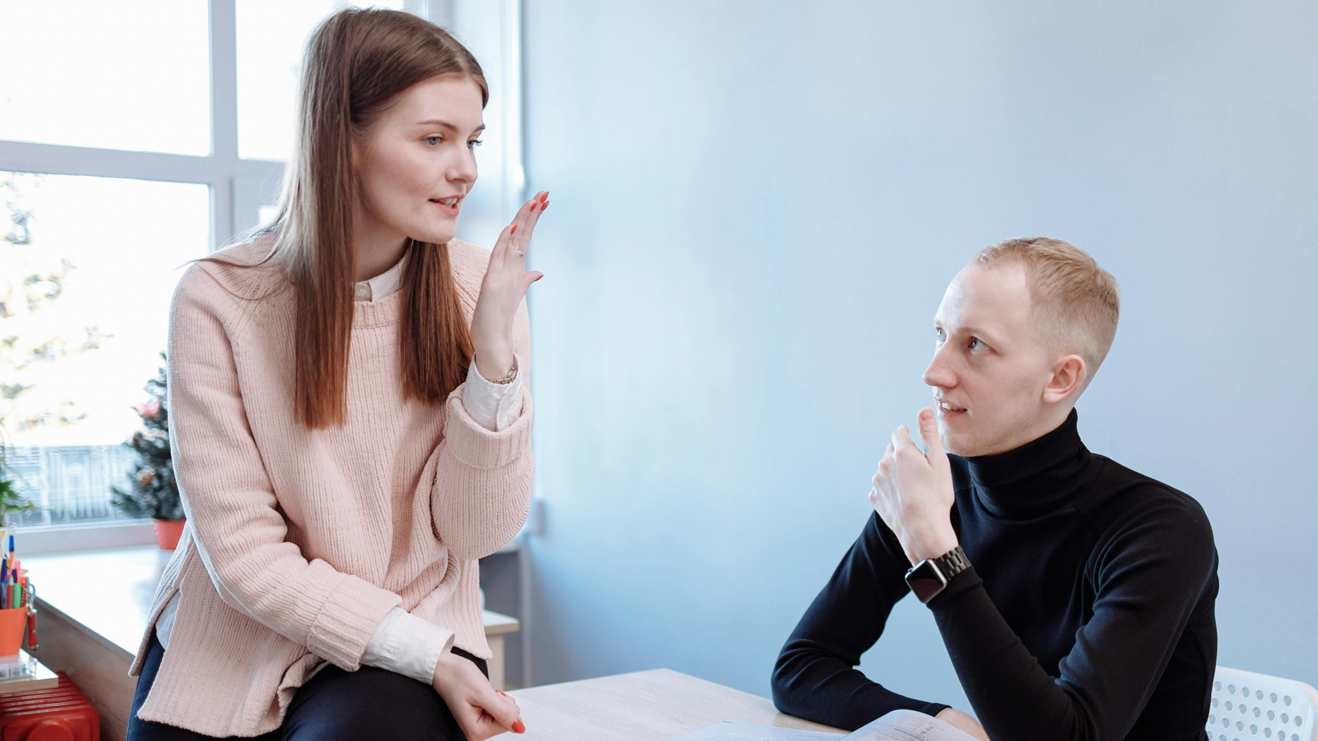 Female tutoring talking to her male student